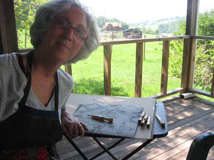 Cutting linocut with the goats